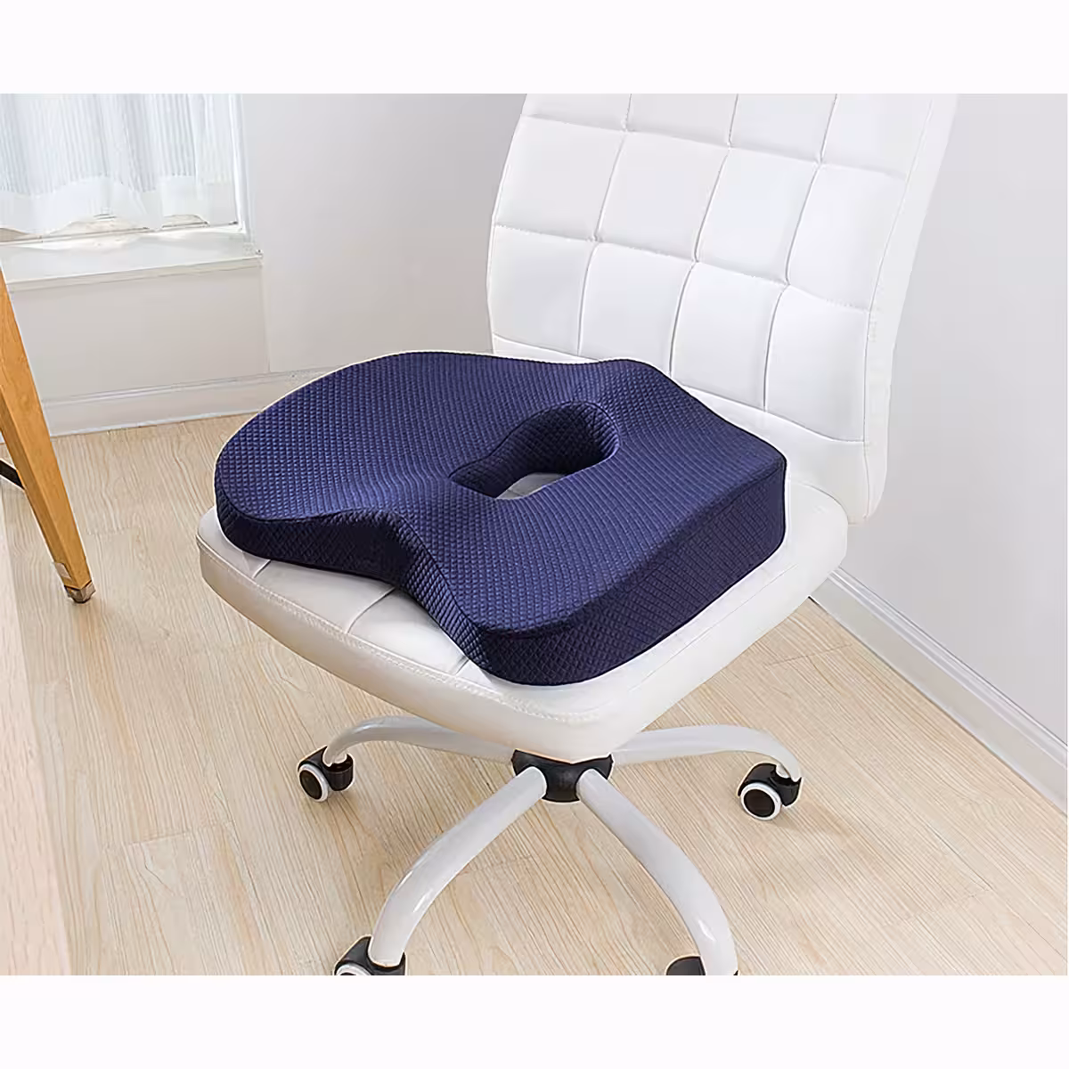 Kannettava tyyny selän ja istumisen kipujen lievitykseen